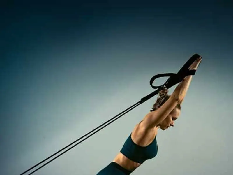 A kneeling arm exercise on the Pilates Reformer
